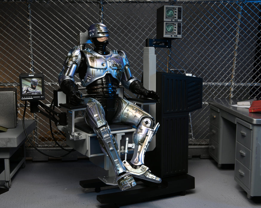 RoboCop Ultimate Battle-Damaged RoboCop with Chair 7-Inch Scale Action Figure