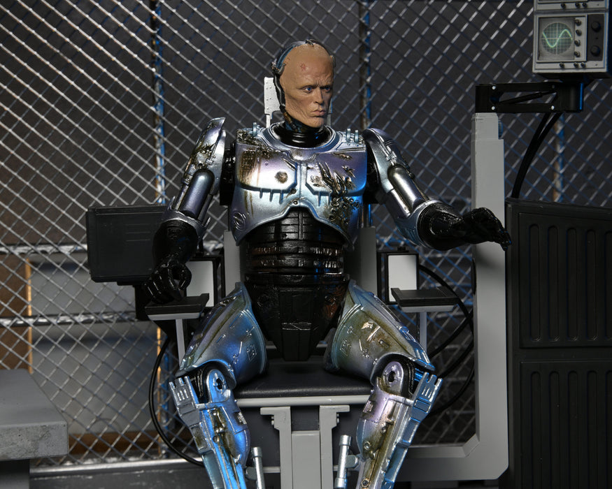 RoboCop Ultimate Battle-Damaged RoboCop with Chair 7-Inch Scale Action Figure