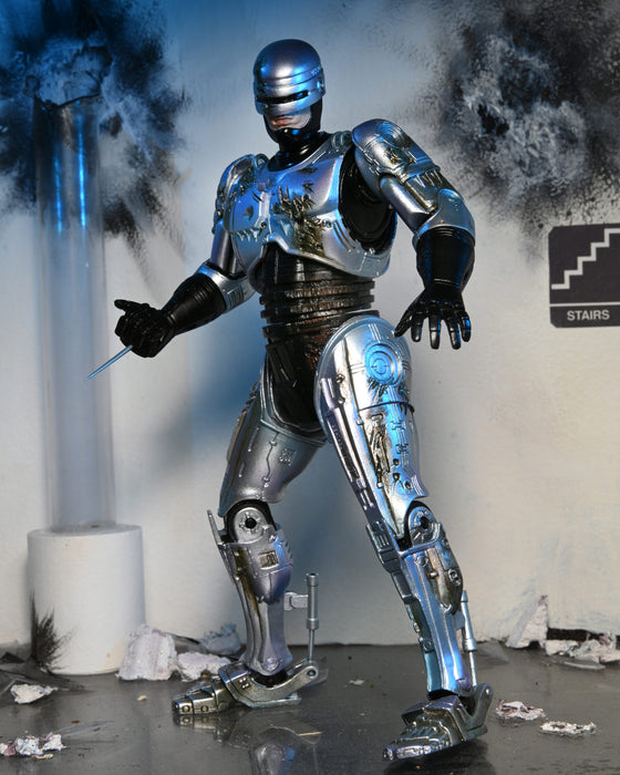 RoboCop Ultimate Battle-Damaged RoboCop with Chair 7-Inch Scale Action Figure