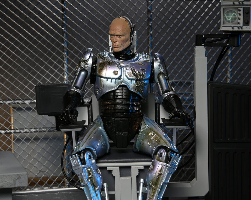 RoboCop Ultimate Battle-Damaged RoboCop with Chair 7-Inch Scale Action Figure